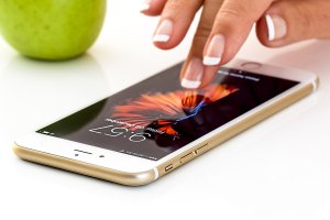 Woman's fingers touching an iphone